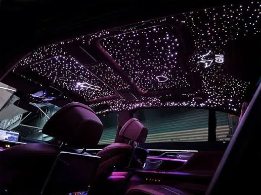 Starlight headliner with dense blue star field covering a vehicle roof