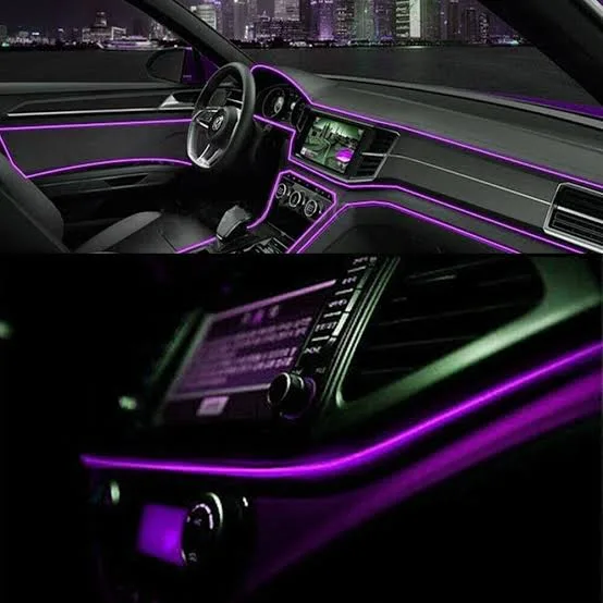 Custom interior ambient lighting on a vehicle center console and cupholders