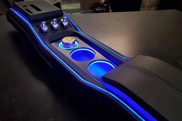 Multi-panel ambient lighting covering door trim and dash in a vehicle