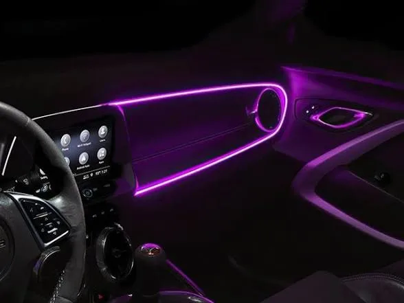 Door panel ambient lighting integrated into vehicle trim, factory-look finish