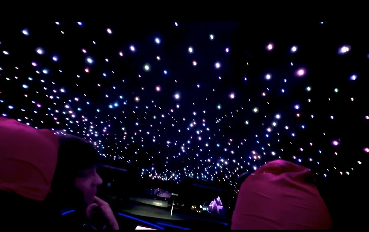 Multi-color fiber-optic star field shown across a vehicle headliner