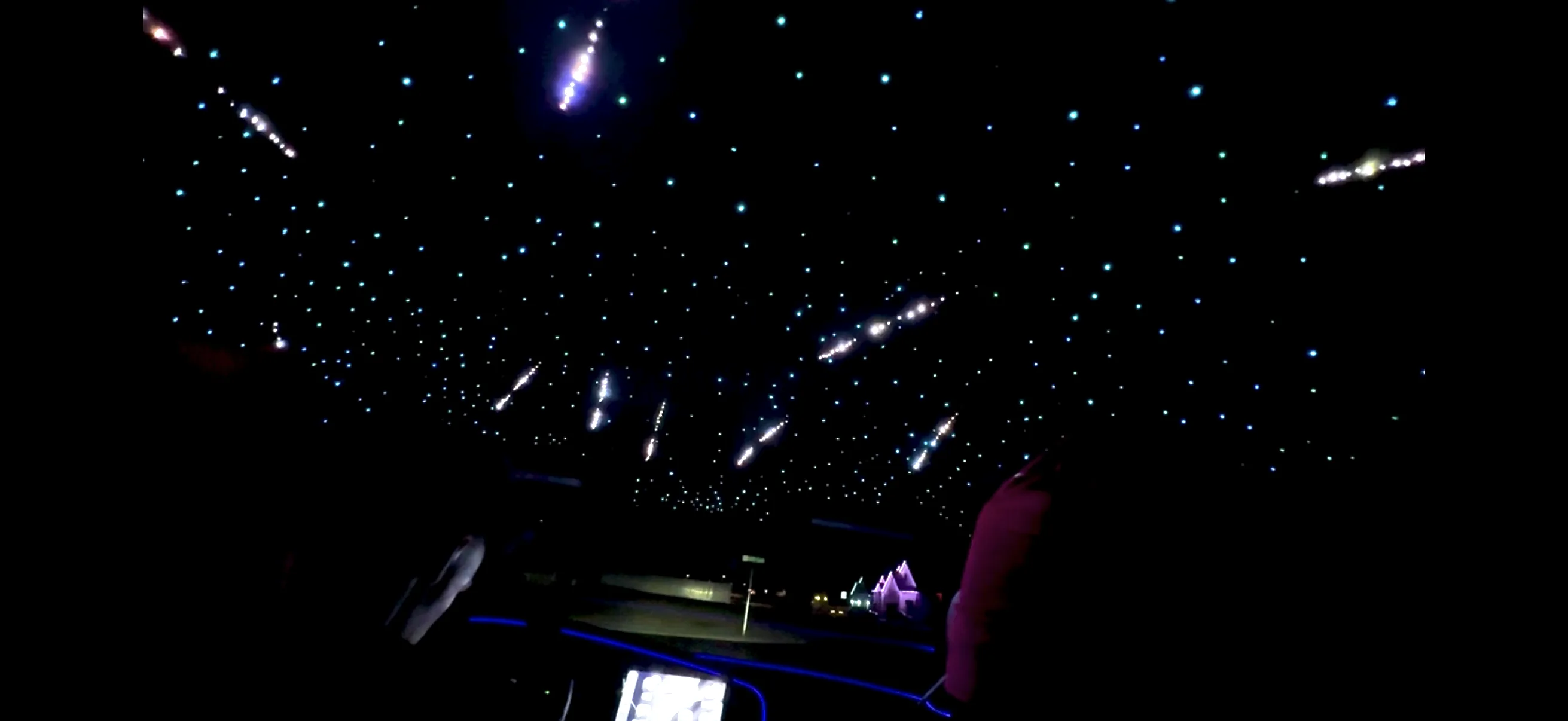 Multicolor fiber-optic starlight headliner panel showing full star field