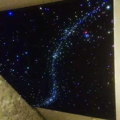 Detail of hand-threaded fiber-optic star points in a StarLight suede ceiling panel