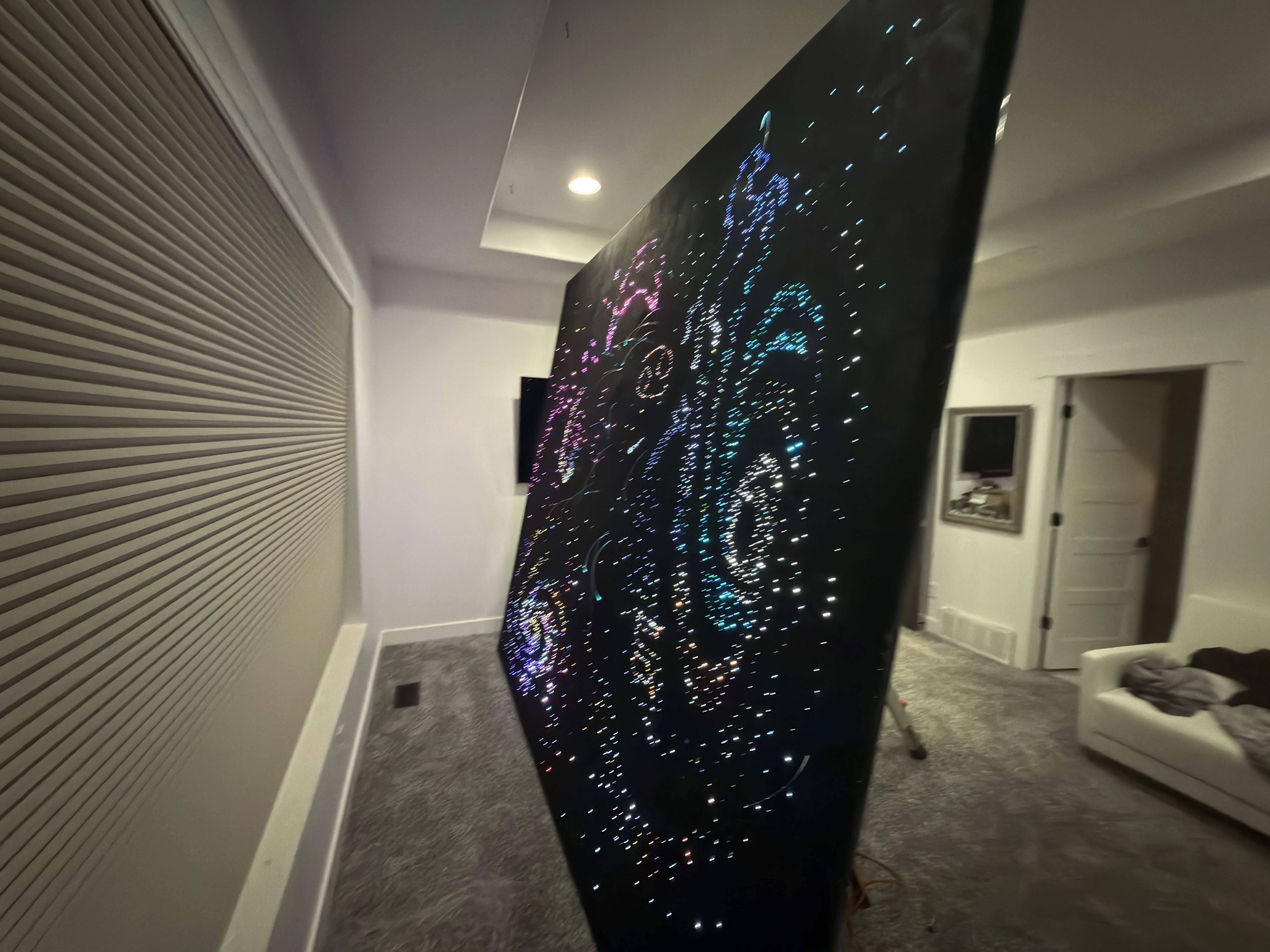 Custom starlight panel lit up during installation, showing the full fiber-optic design