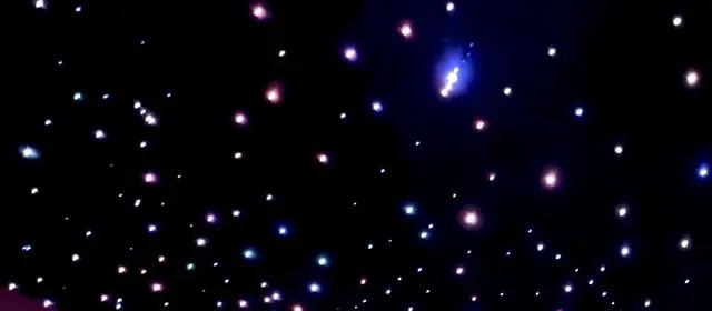 Close-up of individual fiber-optic light points in a headliner